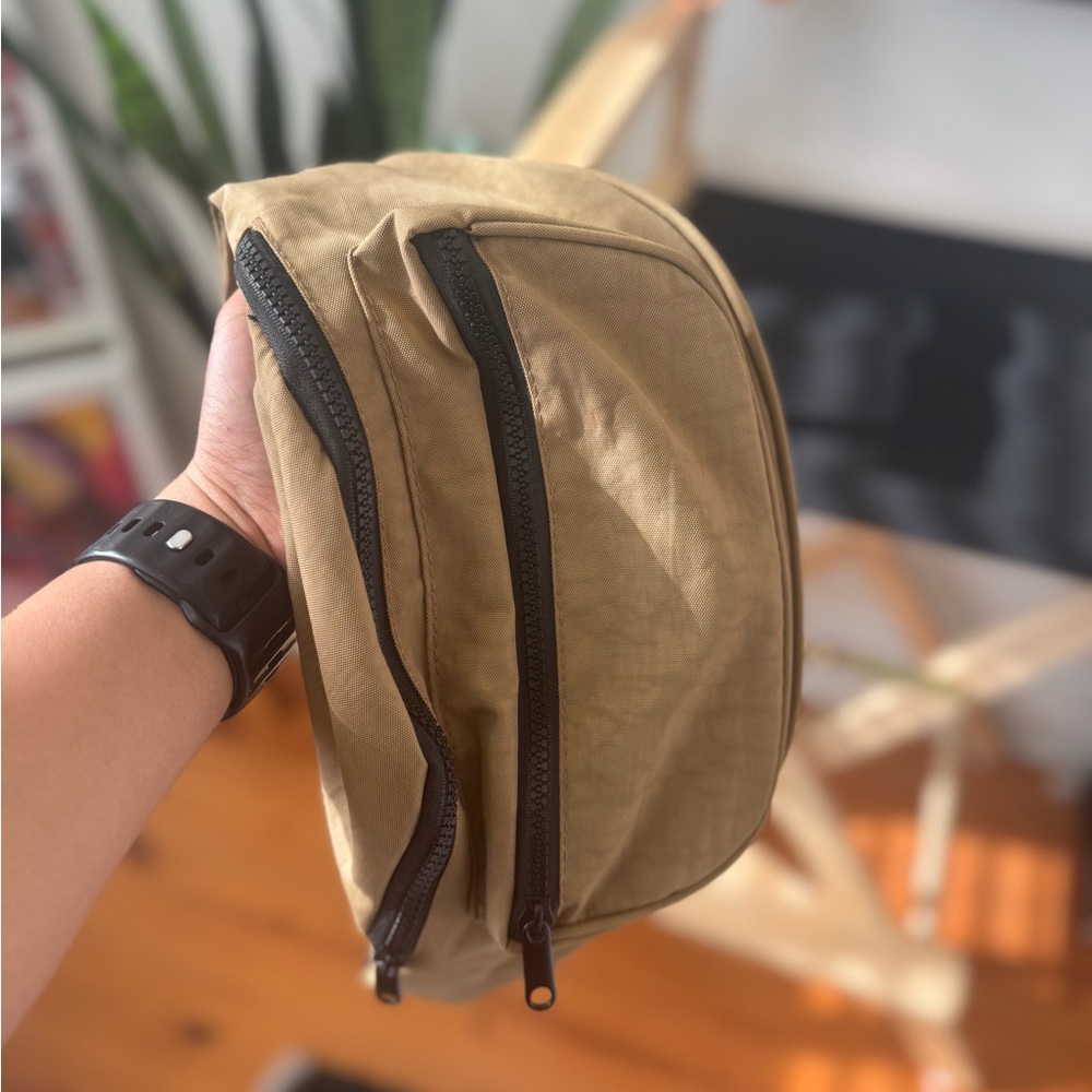 Elegant Tan Crossbody Bag with Black Zippers
